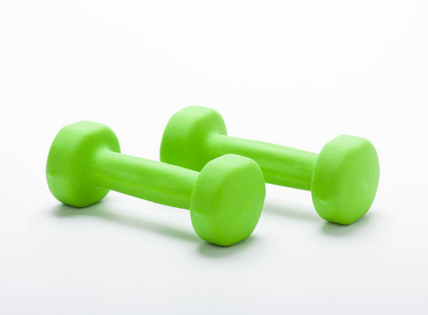istock small green dumbbells,  isolated in white 186397201