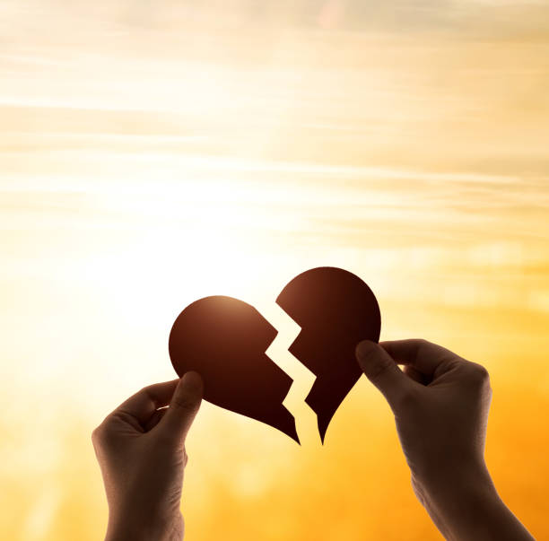 Woman hands holding broken heart