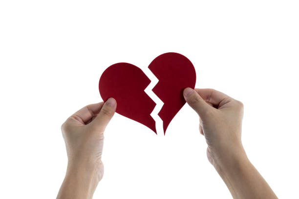 istock Woman hands holding broken heart 1863981326