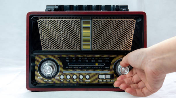 istock A Female Fingers Tuning the Frequency on an Old Vintage Analog Receiver 1863982873