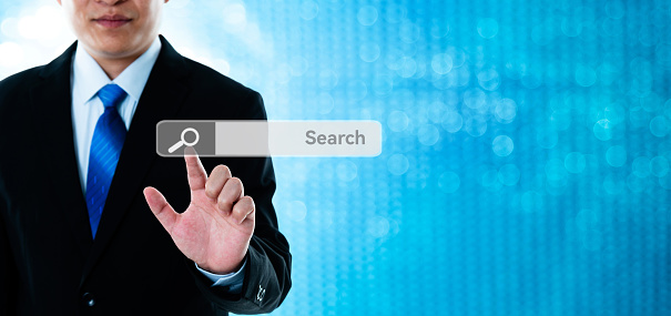 Businessman finger touching empty search bar on virtual touch screen