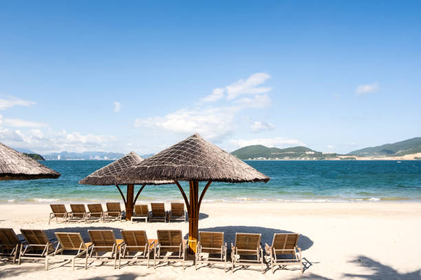 istock Beach lounges and umbrellas on the beach. 1863999980