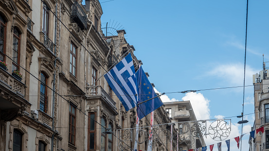 Taksim, Istanbul, Turkey Sep. 30, 2023: Greek and European Union flags on historical building of Greece Consulate General Istanbul