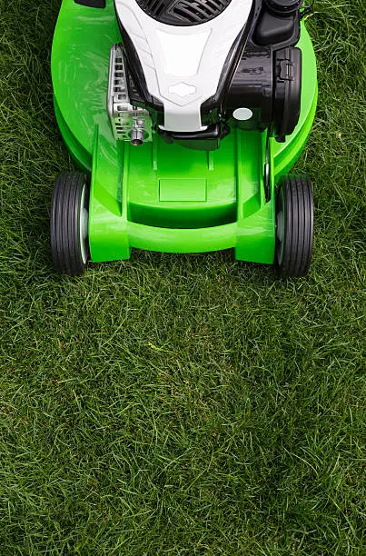 Outdoor shot of green lawnmower