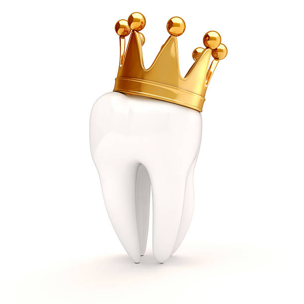 istock 3d white tooth with gold grown on top 186400250