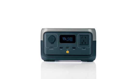 Portable power station or power box isolated on white background. On-the-Go energy solution. Power supply for outdoor adventure. Compact portable power box with a rechargeable lithium-ion battery.