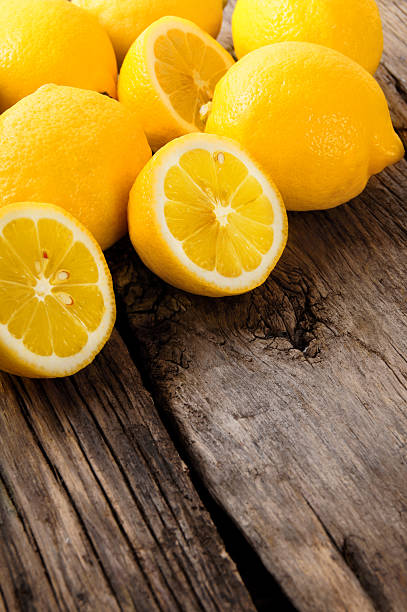 istock Lemons. On wooden board. 186400991