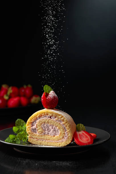 istock Delicious strawberry biscuit cake sprinkled with sugar powder. 1864011934