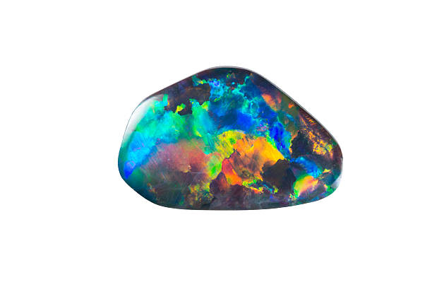 A pet rock painted with neon, glow-in-the-dark colors A cropped opal with a complete color spectrum opal photos stock pictures, royalty-free photos & images