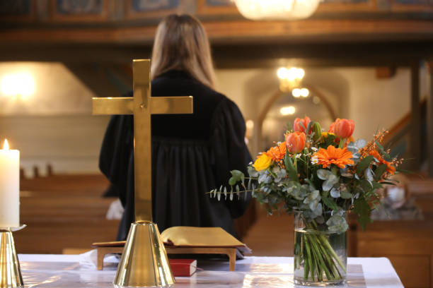 istock Female Vicar holds service in a Protestant church 1864031021