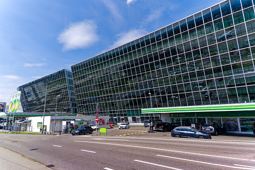 Modern glass facade of office tower named The Circle at Zürich Kloten Airport on a sunny summer day. Photo taken July 23rd, 2023, Zurich, Switzerland.