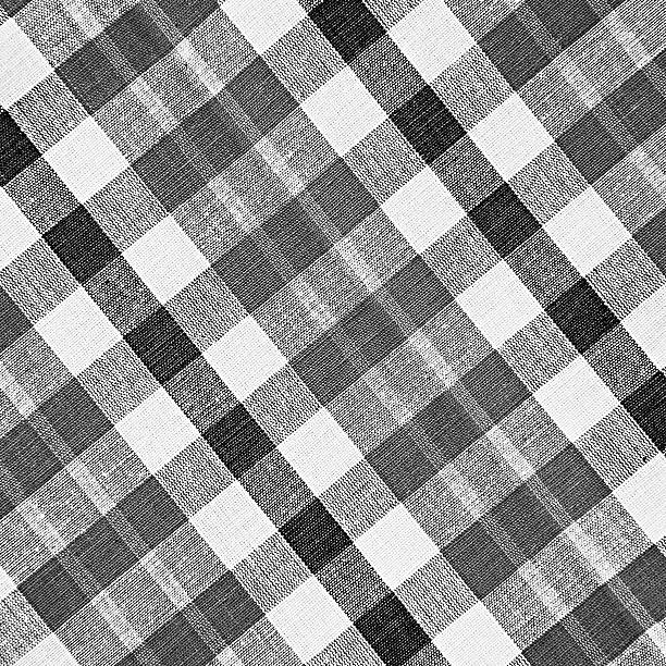 Black and white loincloth texture Black and white checkered loincloth fabric texture as background loin cloth stock pictures, royalty-free photos & images