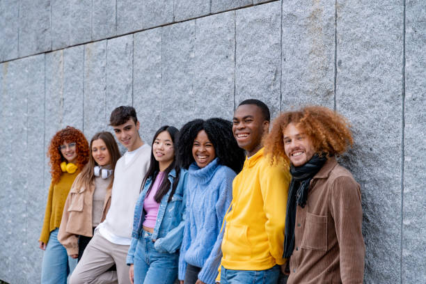 istock Happy multiethnic people smiling while posing outdoors. 1864051740