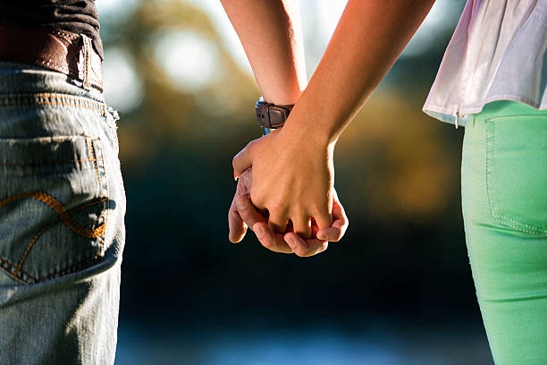 Couple Holding Hands stock photo