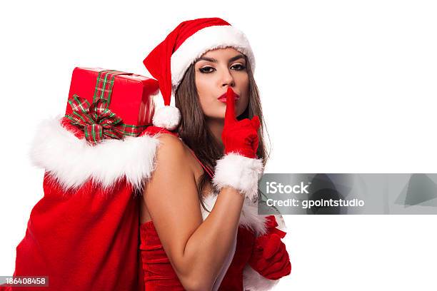 Sexy Santa Claus Woman With Christmas Sack Saying Shh Stock Photo - Download Image Now