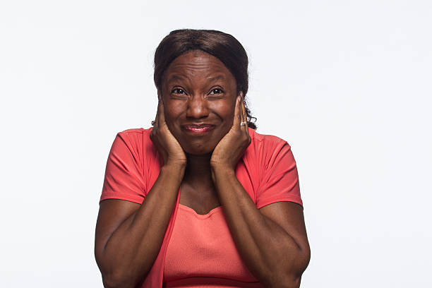 istock African American woman covers her ears, horizontal 186408789