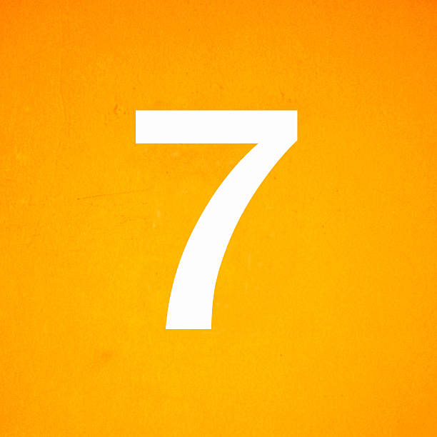 istock close up on white stenciled number seven yellow wall 186411250