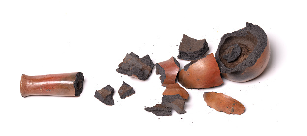 Old brown pottery, isolated on a white background