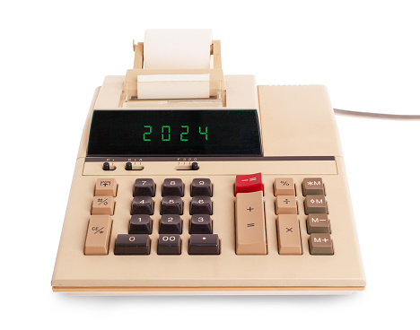 Old calculator showing a text on display - 2024, new year