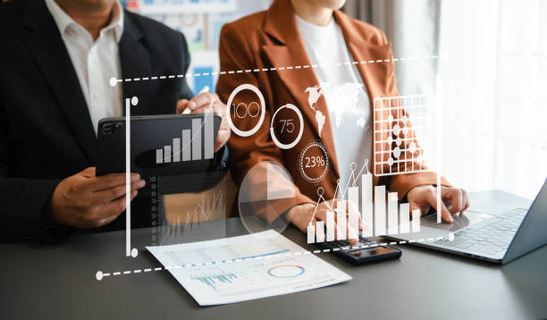 istock Team colleagues wear formal attire to work together to optimize business processes by using new technologies. high tech hologram 1864127093