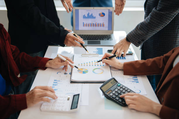 istock Business People Planning Strategy Analysis Office Concept. writing notes about sticky notes Laptop,tablet  Planning and Brainstorming Strategies in office 1864127340