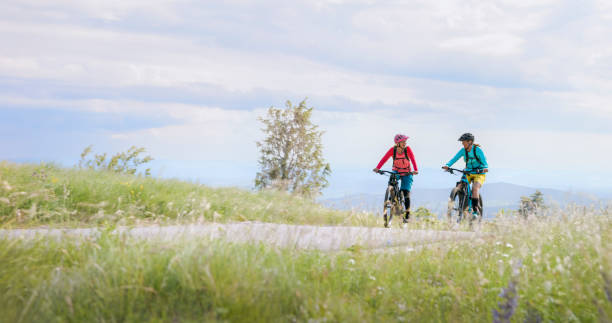 istock Women riding electric bicycles 1864128254