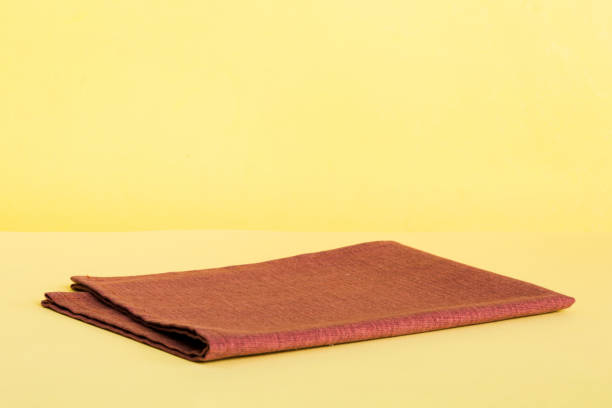 istock top view with red empty kitchen napkin isolated on table background. Folded cloth for mockup with copy space, Flat lay. Minimal style 1864128291