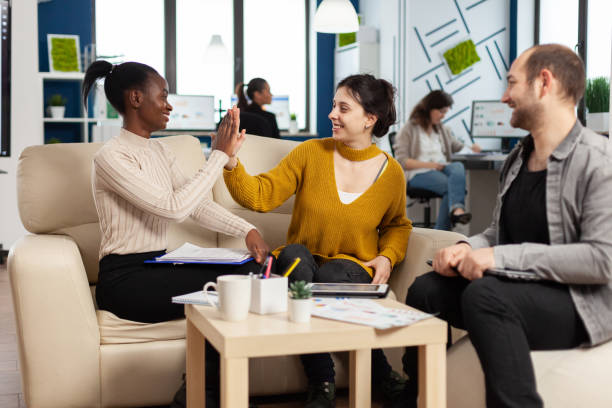 istock Confident company manager giving working tasks to diverse teammates 1864128885