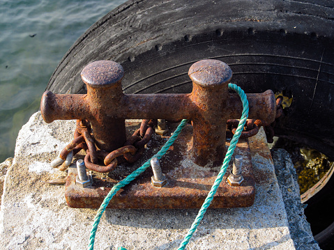 Old rusty mooring equipment on pier