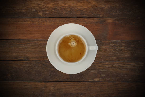 istock Cup of coffee  on wooden table 1864133115