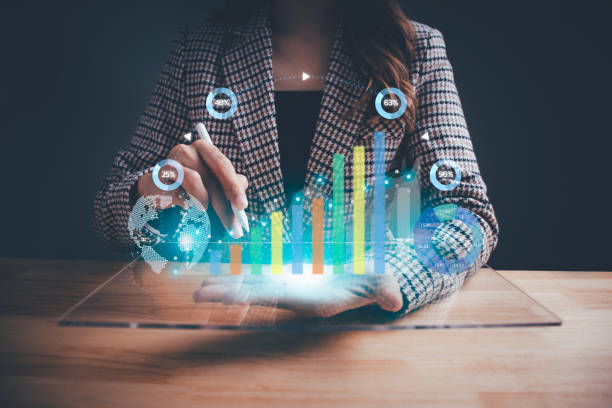istock Businesswoman using digital tablet analyzing sales data and virtual growth graph. Business planning and strategy, progress or success, investment, digital marketing concept. 1864146288