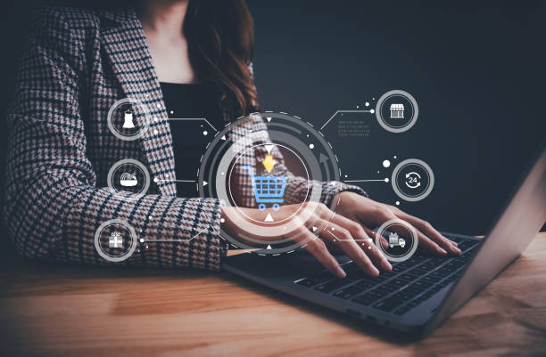istock Businesswoman working on computer analyzing business document for e-commerce and shopping carts and promotional items. Social commerce, digital marketing, market report, online selling, startup. 1864147355