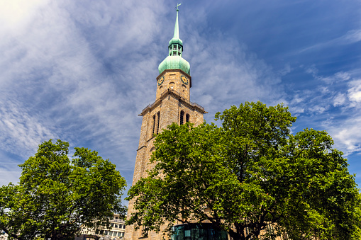 Eindhoven, Netherlands. Saint Catherine Church in the city center. Sint Catharinakerk low angle view, blue sky background