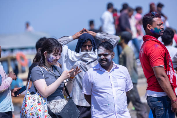 People celebrating masan holi at manikarnika ghat in varanasi stock photo