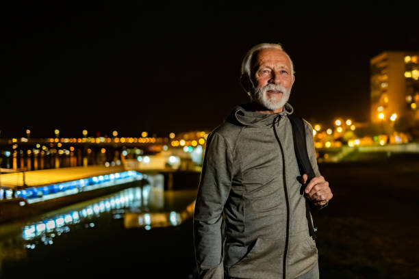 istock Senior man carrying a backpack outdoors. 1864164696