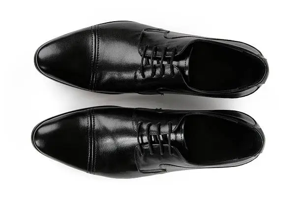 Top view of legant man's shoes (pair) with shoelaces.