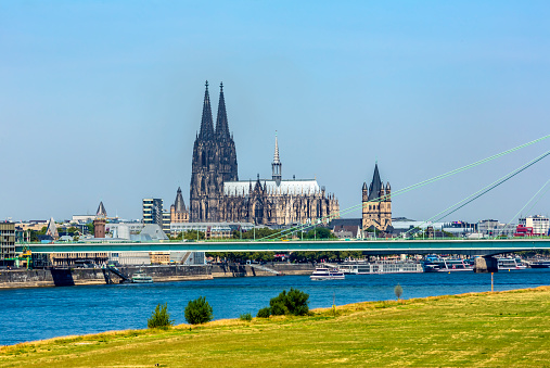 rhine bridge and old town in the shadow of the monumental churches in the old town of cologne