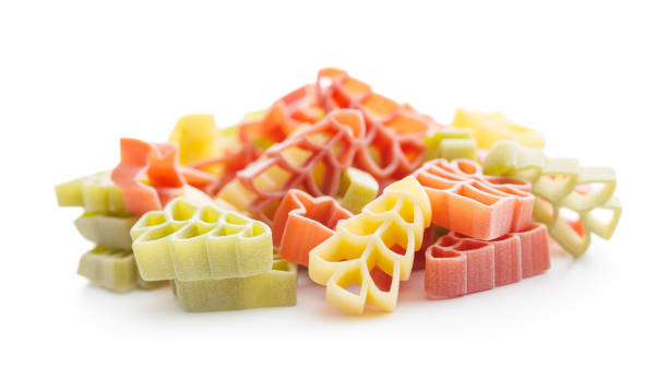 istock Uncooked raw pasta. Various Christmas shapes. Pasta isolated on white background. 1864215636