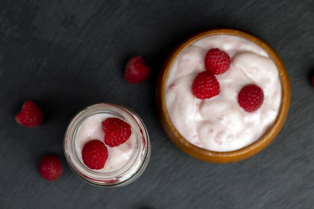 istock fresh yogurt with raspberry flavor, close up 1864217283