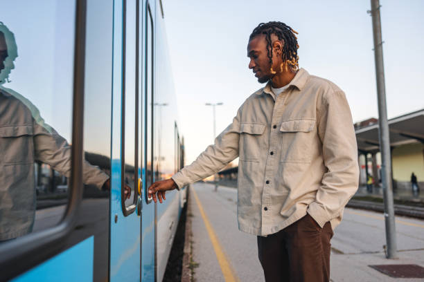 istock Contemplative Traveler at Train Station 1864223015