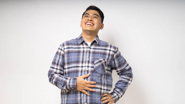 istock Asian Asian smiling proud while looking to the up side on white background. studio shot 1864229959