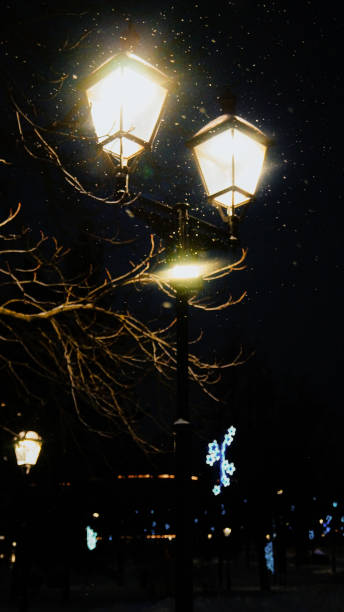 istock Lantern in a winter snowstorm 1864238931