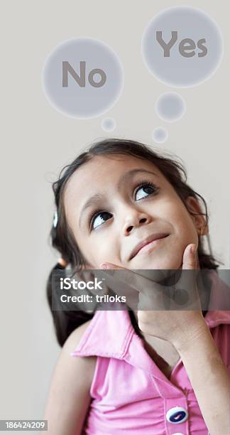 Cute Girl With Yes Or No Thought Bubbles Stock Photo - Download Image Now - Adult, Asking, Baby - Human Age