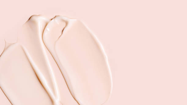 istock cosmetic smear texture on pastel beige background 1864261135