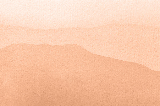 color trend 2024 peach fuzz. Abstract light coral art background. Watercolor painting on canvas with soft beige wavy gradient. Texture backdrop.