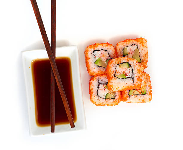 istock Sushi with chopsticks isolated over white background 186427376