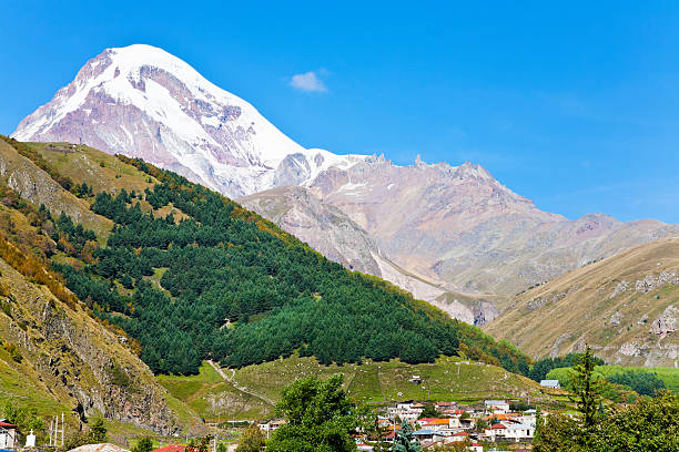 istock village Stepantsminda and Mount Kazbek in Georgia 186427433