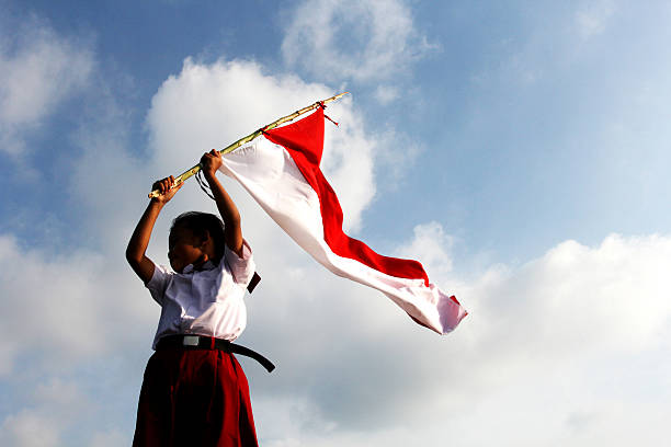 Indonesian Flag an elementary school pupils raised the Indonesian flag indonesian culture stock pictures, royalty-free photos & images