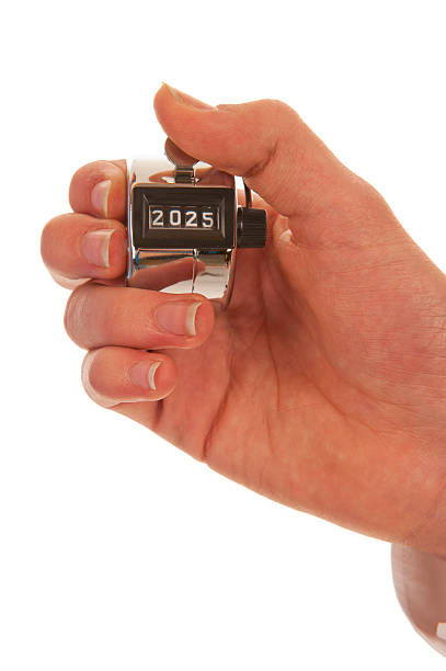 Hand holding a pedometer closeup stock photo