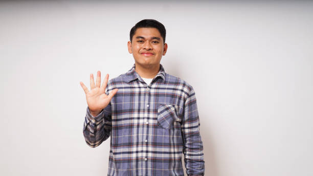 istock Young Asian man showing lima fingers sign 1864291193